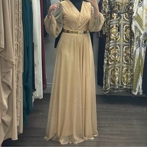 This sparkling gold dress was worn once.long sleeves and full back coverage.